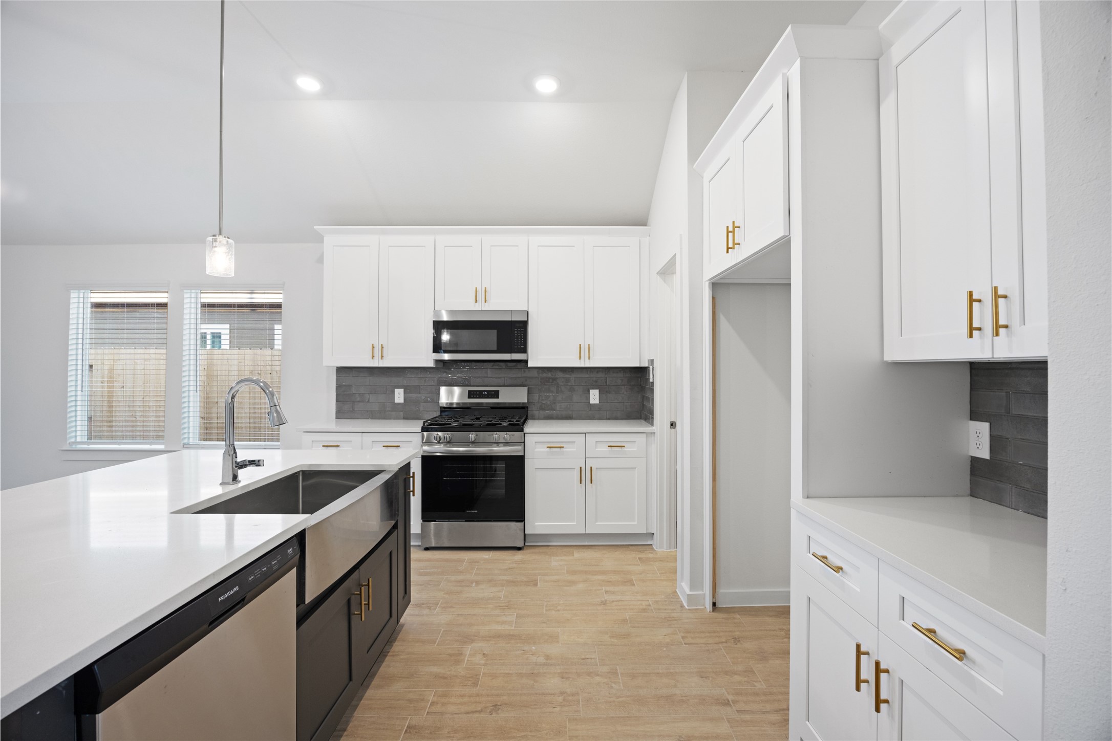 1123 Santee Court Rosharon, TX 77583 - Photo 13 of 30 a kitchen with stainless steel appliances a stove sink and refrigerator