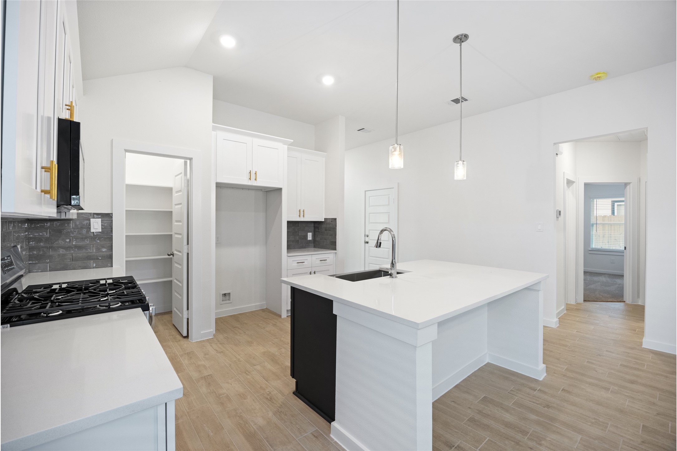 1123 Santee Court Rosharon, TX 77583 - Photo 15 of 30 a kitchen with a sink a counter stainless steel appliances and cabinets