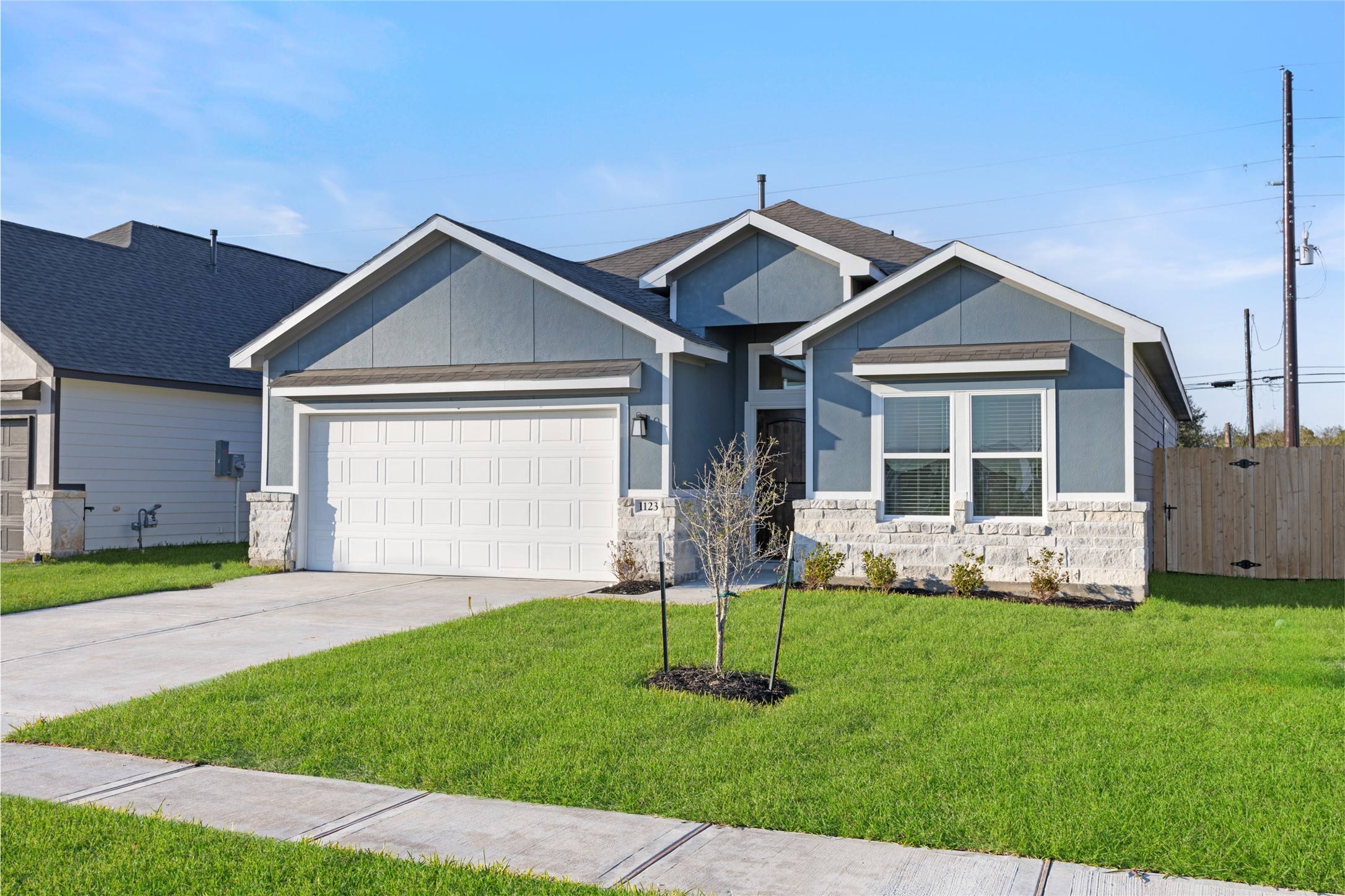 1123 Santee Court Rosharon, TX 77583 - Photo 9 of 30 a front view of a house with a yard and large trees