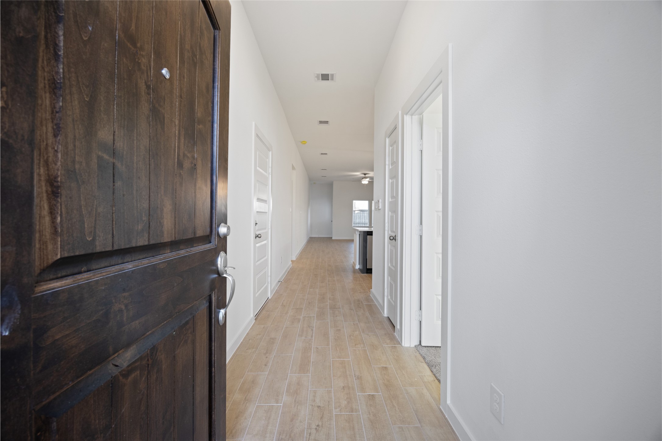 1123 Santee Court Rosharon, TX 77583 - Photo 10 of 30 a view of a hallway with wooden floor