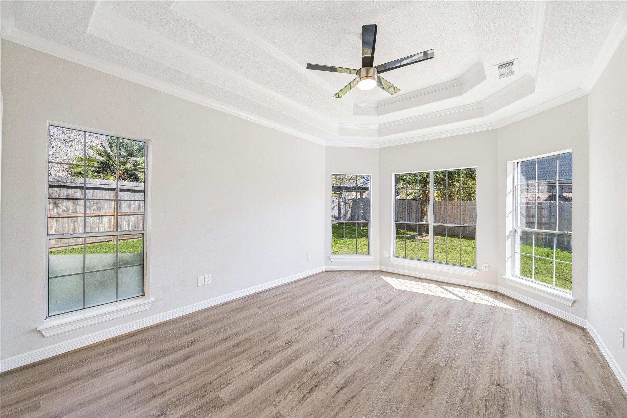 5437 Edgewater Court Willis, TX 77318 - Photo 13 of 29 a view of room with window ceiling fan and wooden floor
