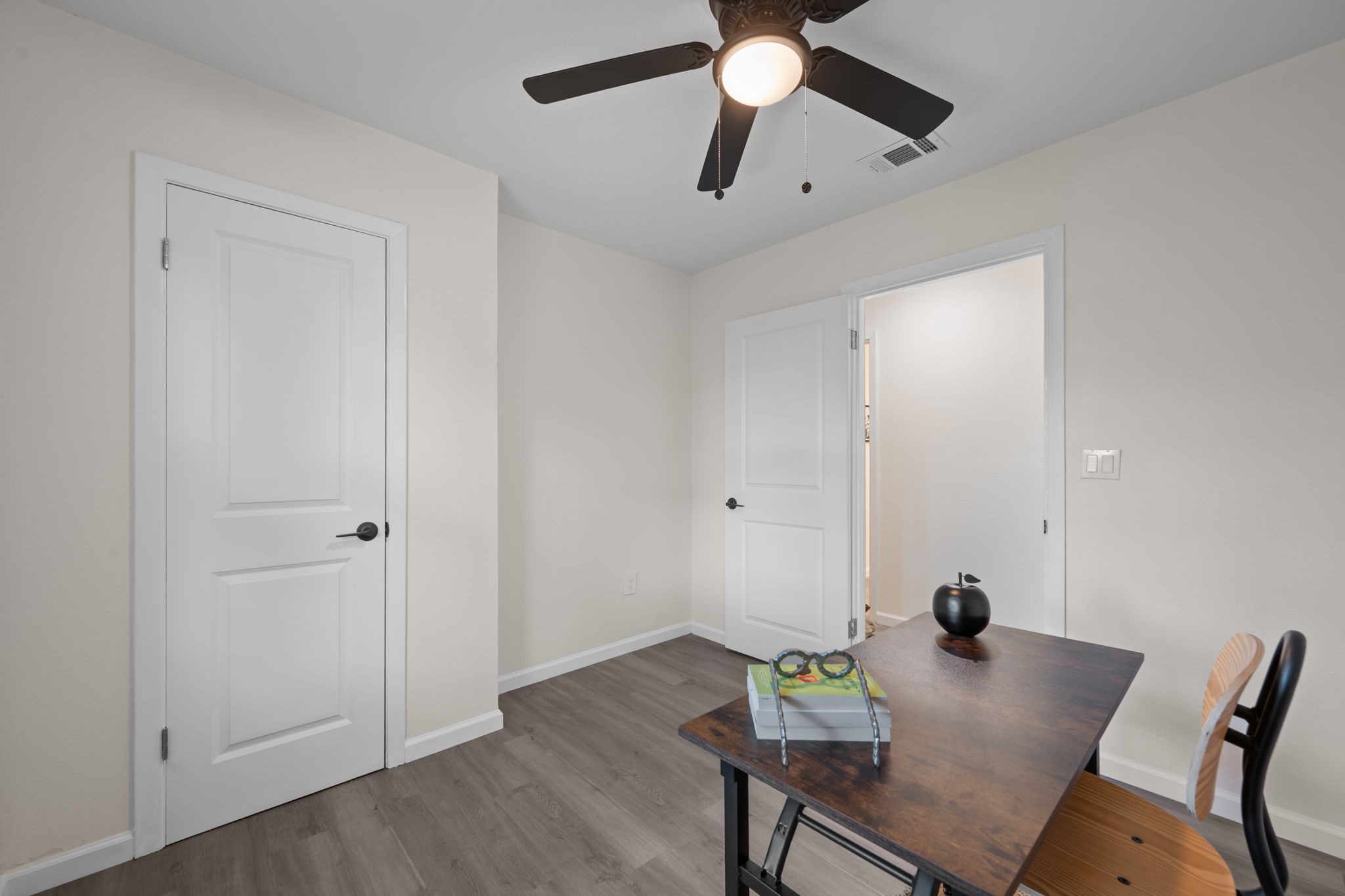 4711 Bandera Road Austin, TX 78721 - Photo 11 of 22 a view of a workspace with furniture and wooden floor