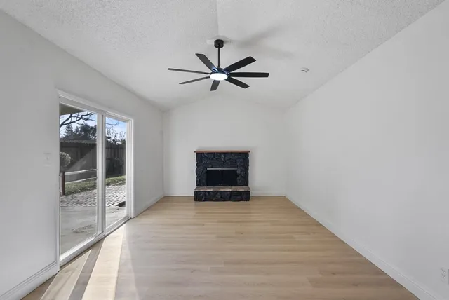 wooden floor in a hall with an empty room