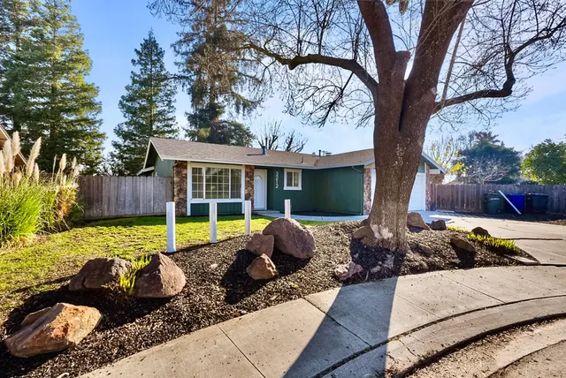 a view of a house with backyard couches and swimming pool