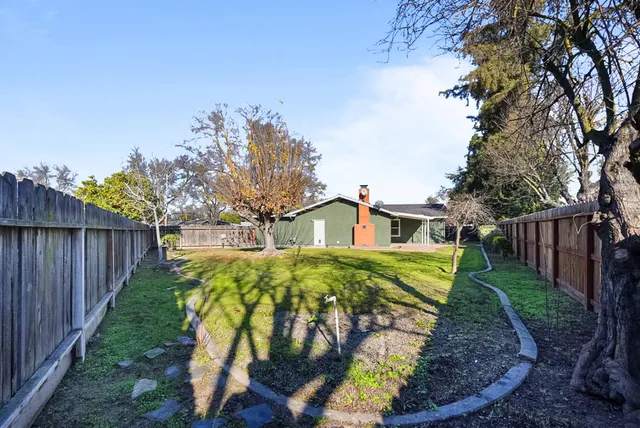 a view of a back yard of the house