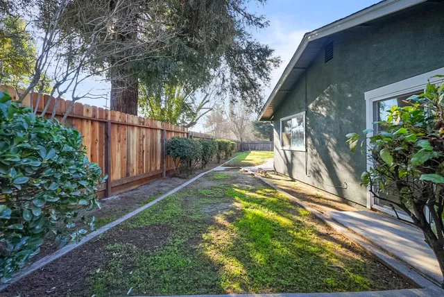 a backyard of a house with lots of green space
