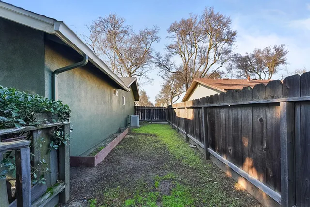 an aerial view of a houses with yard