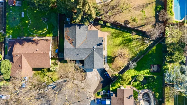 an aerial view of residential houses with outdoor space