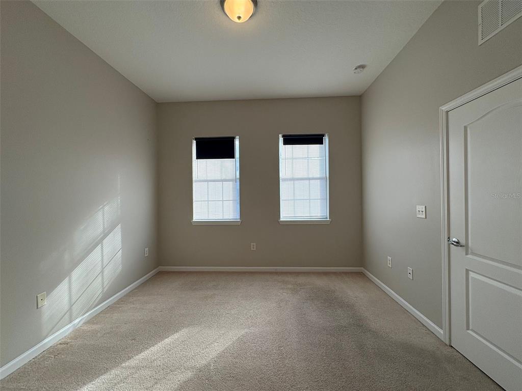 5252 Cane Island Loop, Unit 301 Kissimmee, FL 34746 - Photo 11 of 30 an empty room with windows