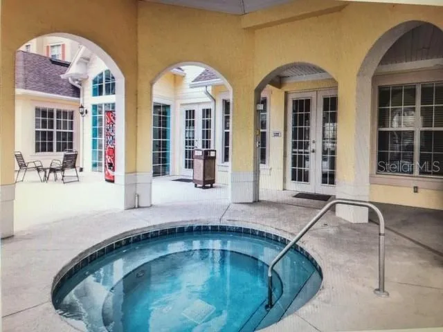 a view of swimming pool with outdoor seating