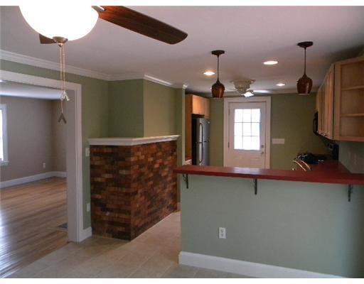 153 Bridgton Road Westbrook, ME 04092 - Photo 13 of 23 Kitchen. living room, kitchen view