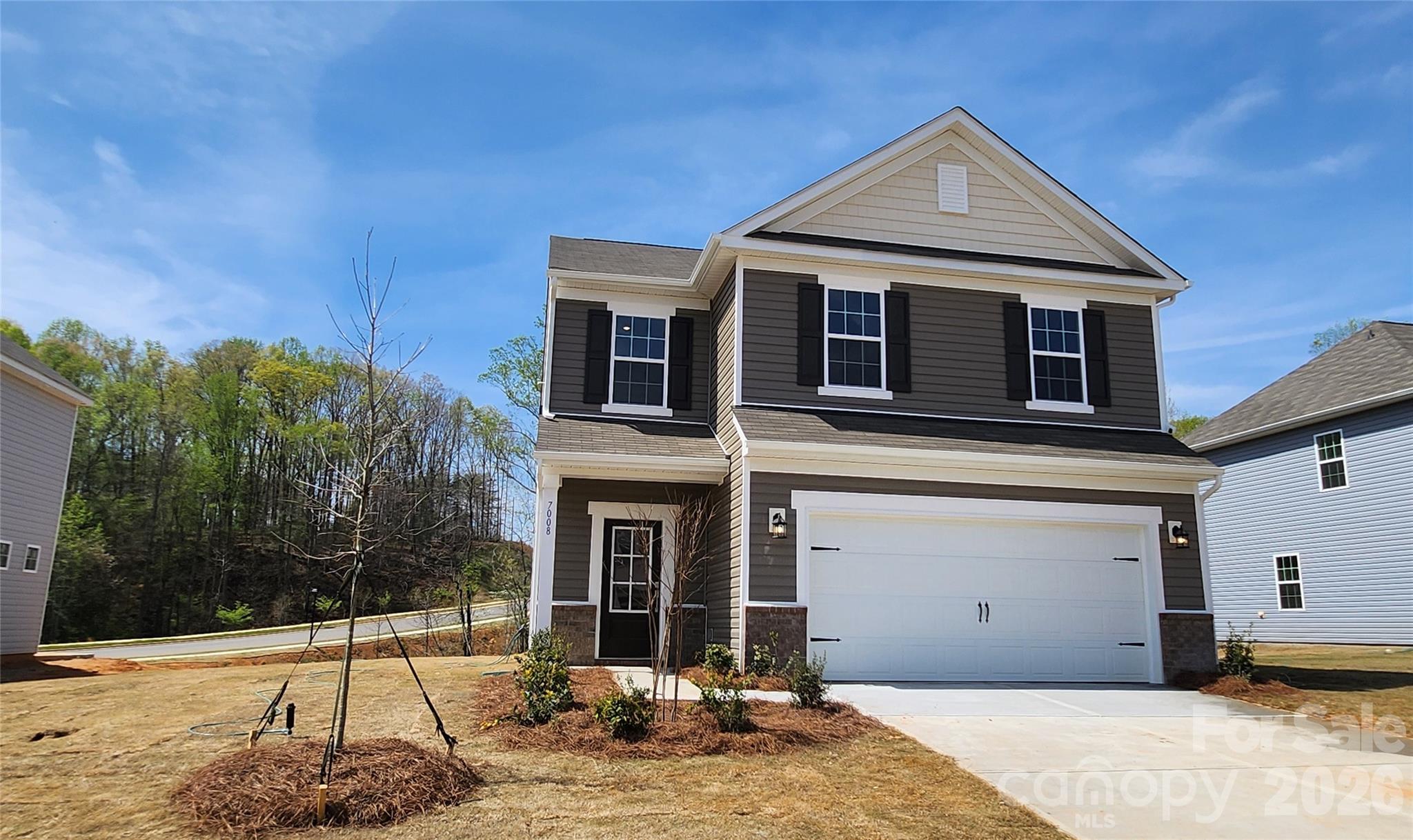 7008 Juneberry Way Maiden, NC 28650 - Photo 1 of 24 a front view of a house with a yard
