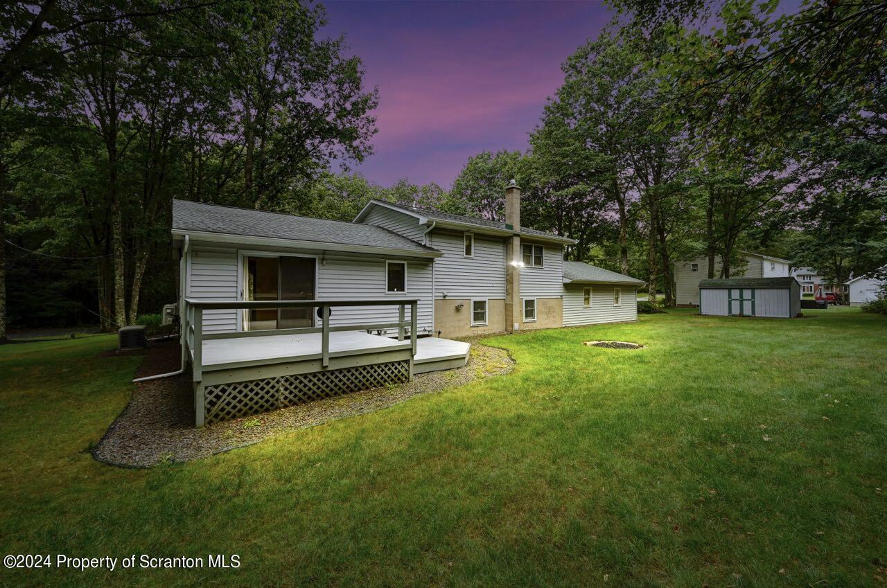 749 Elkview Drive Forest City, PA 18421 - Photo 3 of 73 a white house that has a tree in it