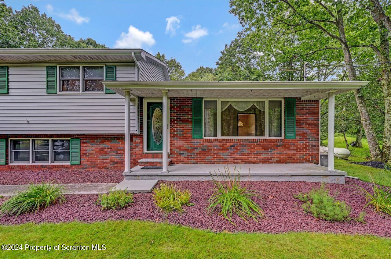 749 Elkview Drive Forest City, PA 18421 - Photo 6 of 73 a front view of a house with garden
