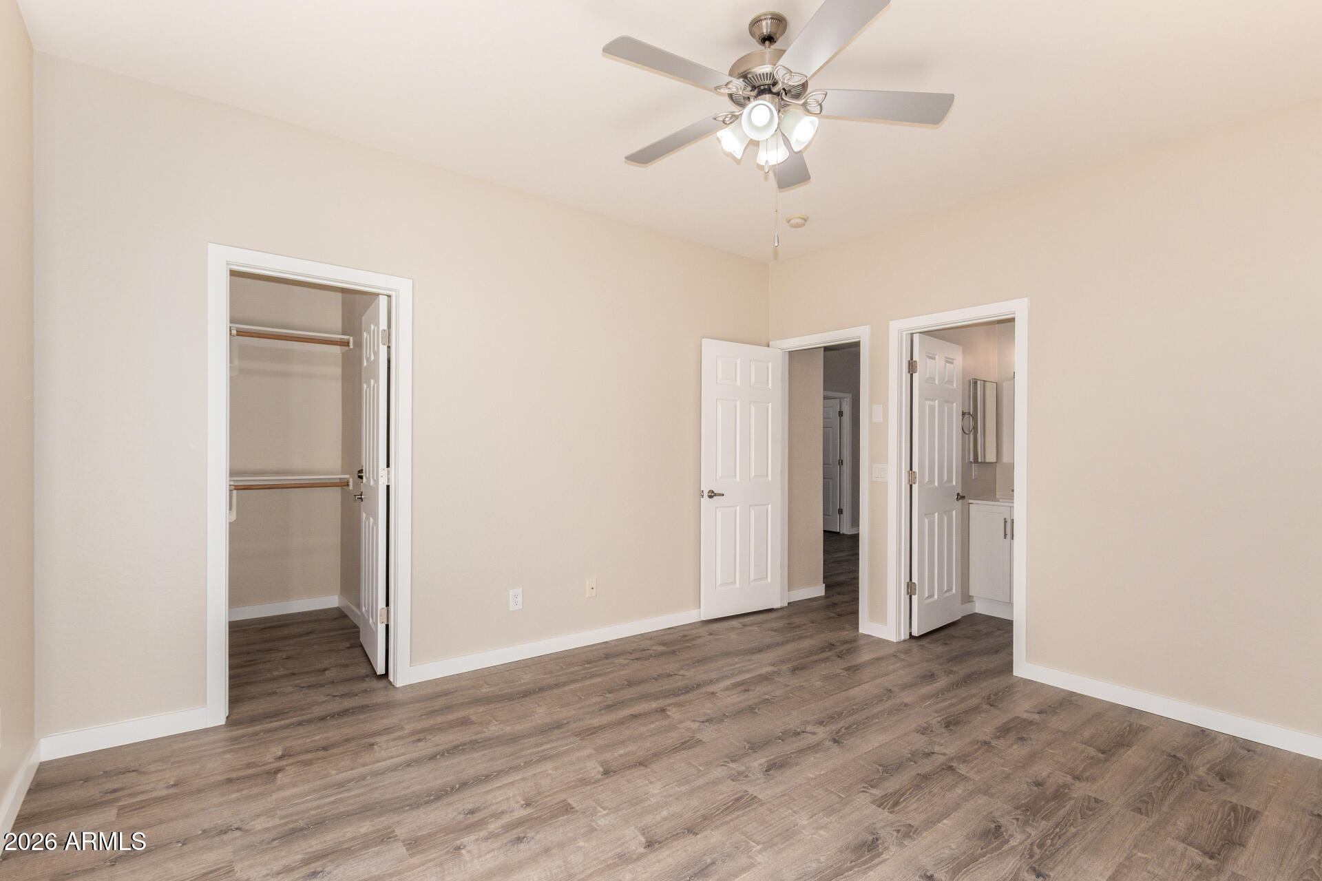 2101 South Meridian Road, Unit 204 Apache Junction, AZ 85120 - Photo 21 of 37 a view of an empty room with wooden floor