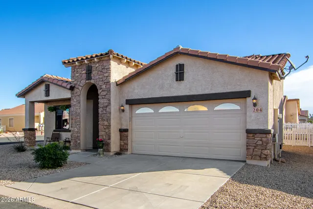 a front view of a house with garage