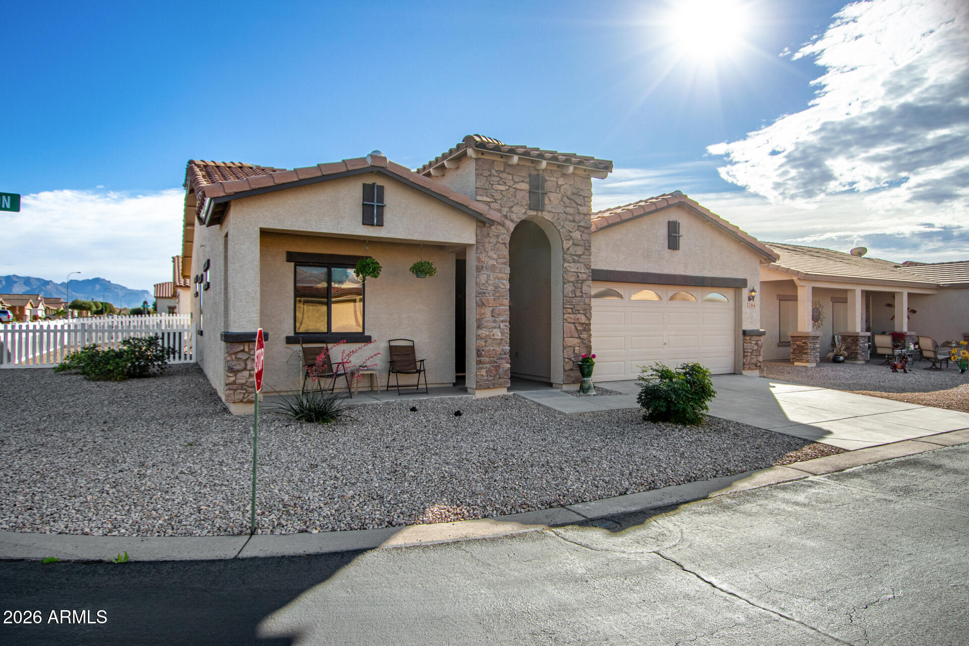 2101 South Meridian Road, Unit 204 Apache Junction, AZ 85120 - Photo 5 of 37 a front view of a house with garden