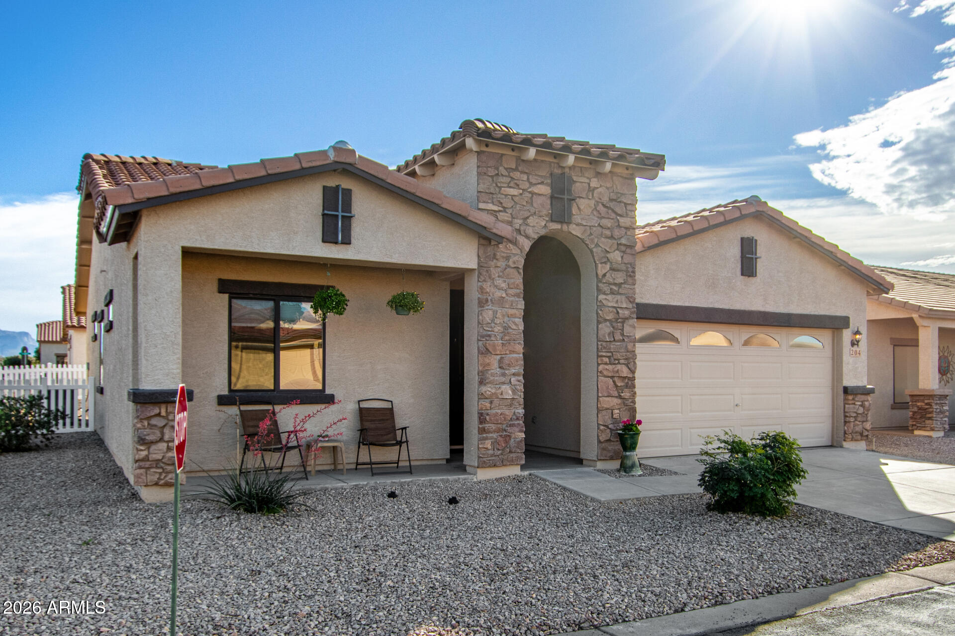 2101 South Meridian Road, Unit 204 Apache Junction, AZ 85120 - Photo 6 of 37 a front view of a house with garden