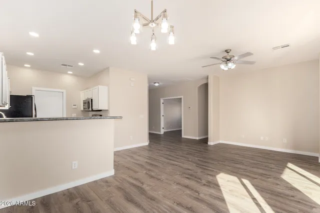 a view of kitchen with sink and wooden floor