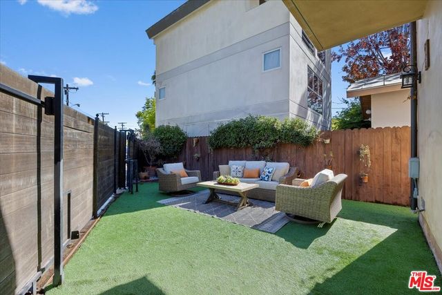 a backyard of a house with seating space