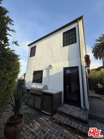 a view of backyard with a potted plant