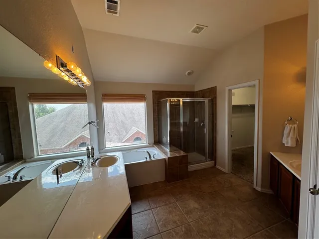 a view of an empty room and a window