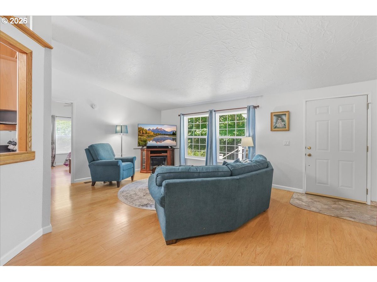 475 East 9th Street Rainier, OR 97048 - Photo 5 of 43 a living room with furniture and a fireplace
