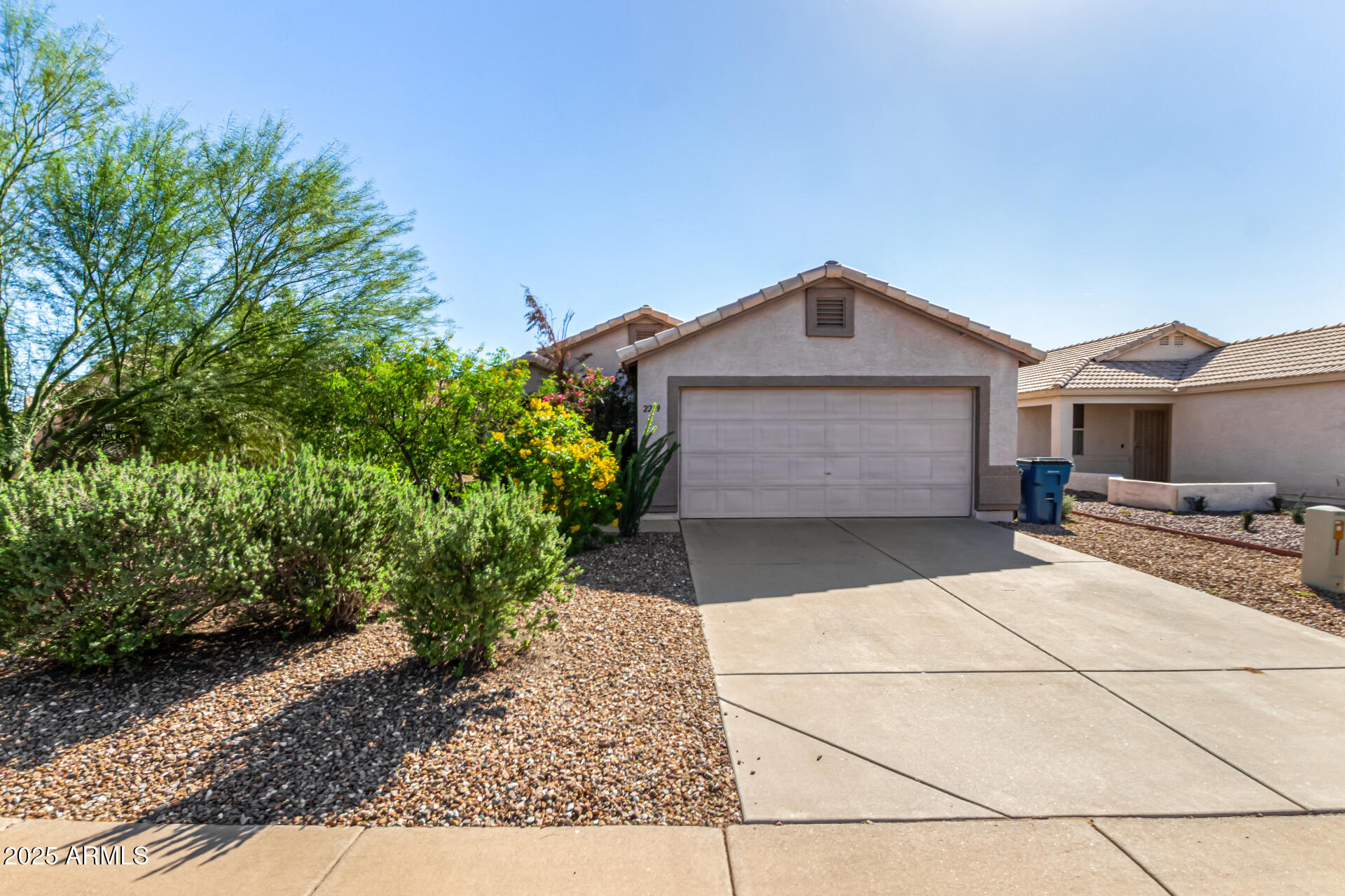 2279 West 20th Avenue Apache Junction, AZ 85120 - Photo 1 of 28 a front view of a house with a garden