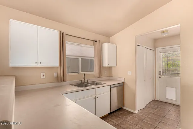 a kitchen with a stove and a refrigerator
