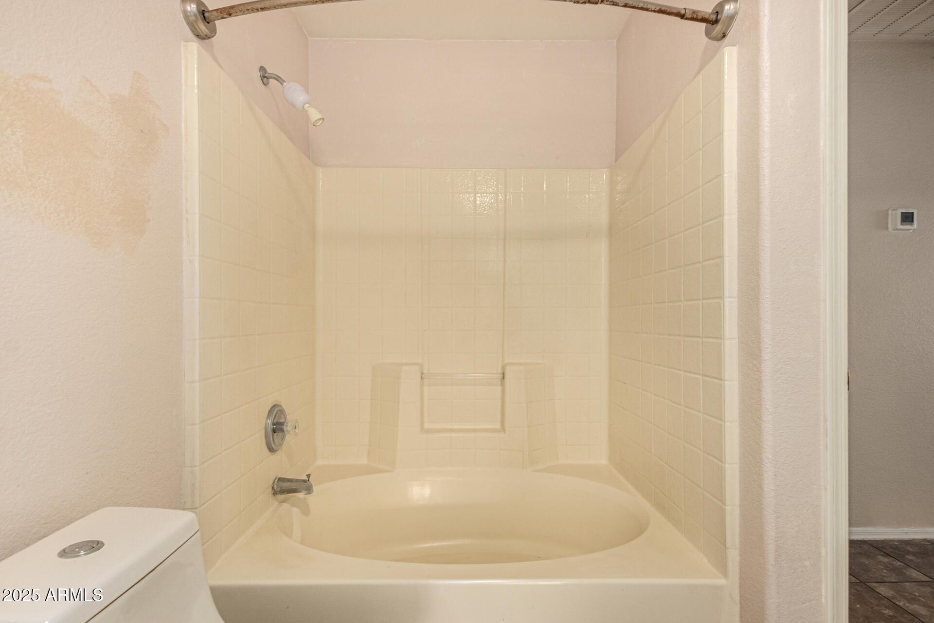 2279 West 20th Avenue Apache Junction, AZ 85120 - Photo 19 of 28 a white bath tub sitting next to a white sink