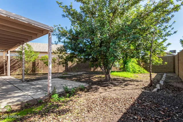 a backyard of a house with lots of green space