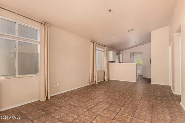 a view of a kitchen with a refrigerator and a sink