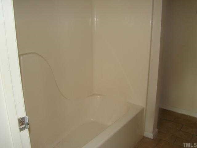 2933 Faversham Place Raleigh, NC 27604 - Photo 8 of 9 a bathroom with a bathtub