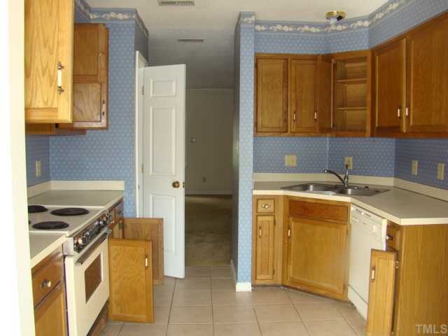2933 Faversham Place Raleigh, NC 27604 - Photo 9 of 9 a kitchen with a sink stove and refrigerator