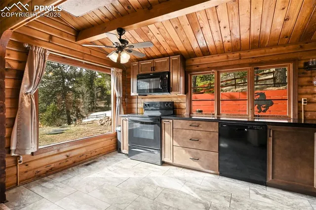 a kitchen with stainless steel appliances granite countertop a stove and a refrigerator