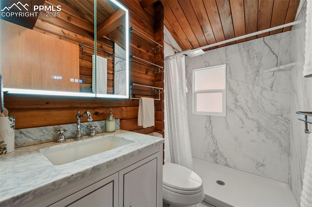 193 Independence Road Cripple Creek, CO 80813 - Photo 19 of 39 a bathroom with a sink and a mirror