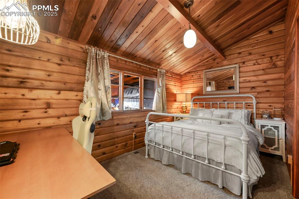 193 Independence Road Cripple Creek, CO 80813 - Photo 20 of 39 a bedroom with a bed and a ceiling fan