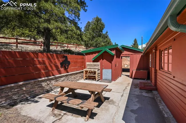 a view of a two chair in the back yard of the house