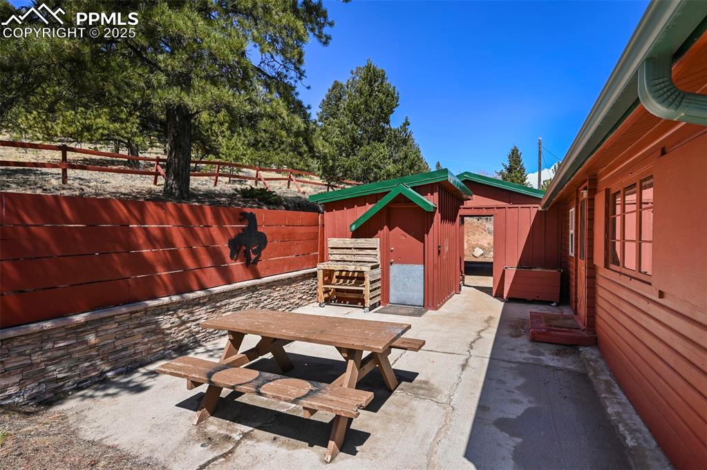 193 Independence Road Cripple Creek, CO 80813 - Photo 24 of 39 a backyard of a house with outdoor seating