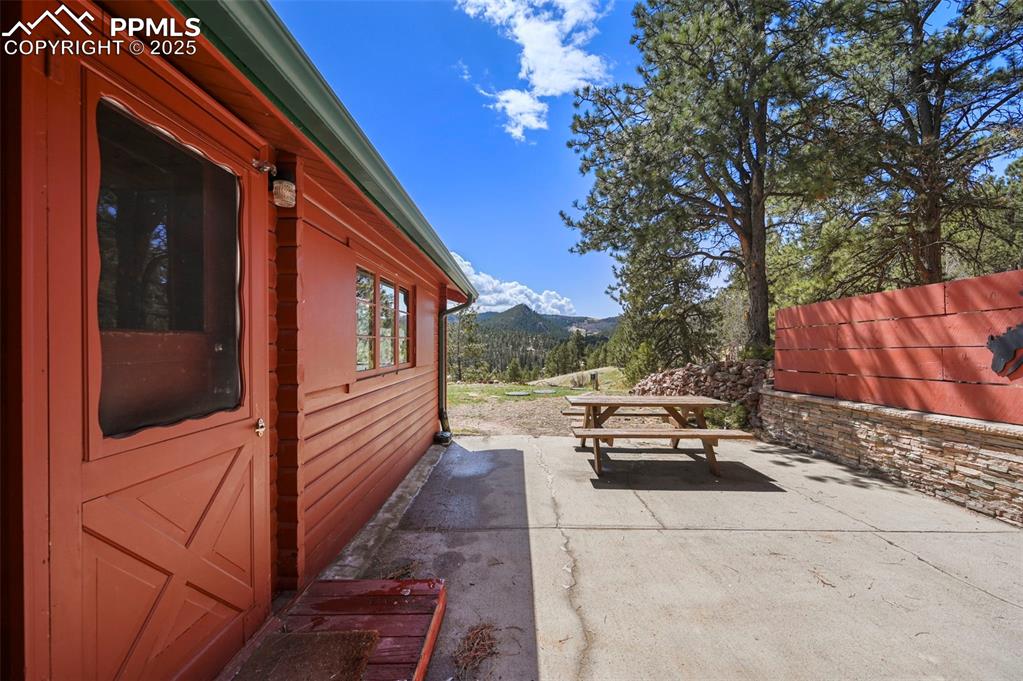 193 Independence Road Cripple Creek, CO 80813 - Photo 25 of 39 a view of a two chair in the back yard of the house