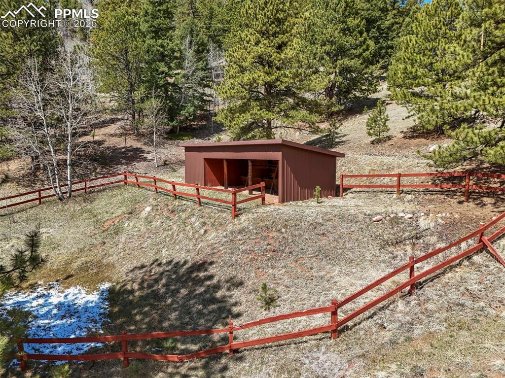 193 Independence Road Cripple Creek, CO 80813 - Photo 29 of 39 a view of a backyard with wooden fence