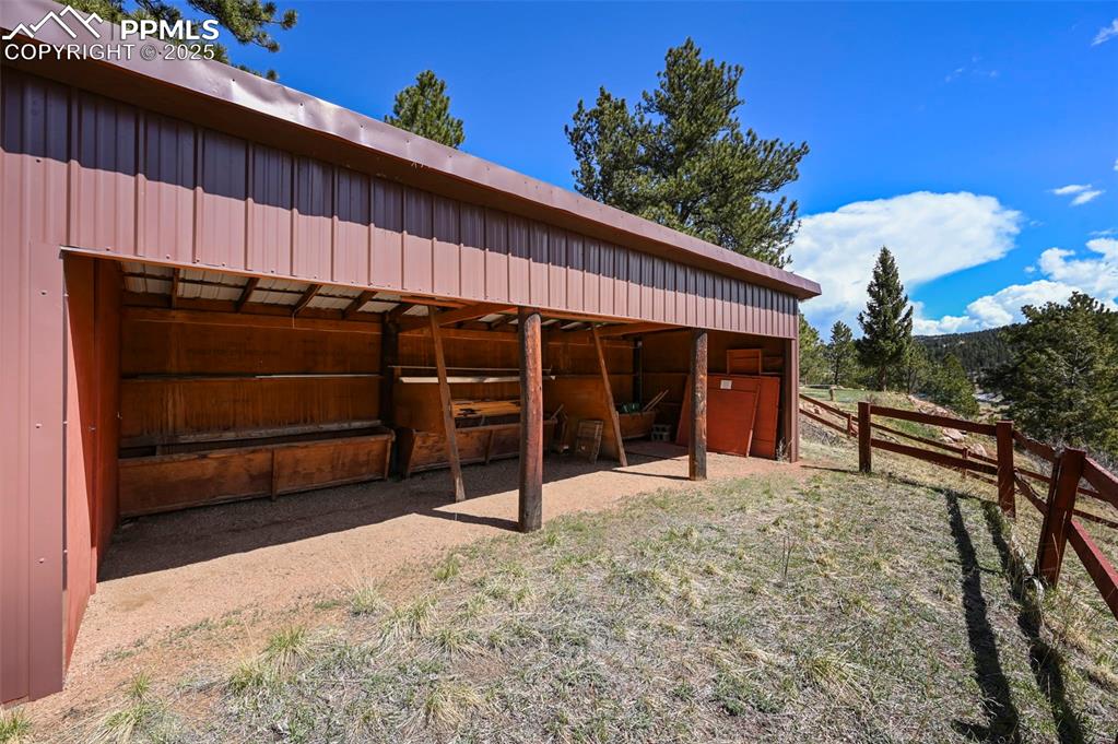193 Independence Road Cripple Creek, CO 80813 - Photo 31 of 39 a view of a house with a yard and wooden fence