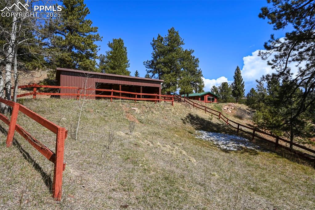 193 Independence Road Cripple Creek, CO 80813 - Photo 33 of 39 a view of a house with a yard