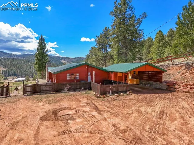 a aerial view of a house with a yard