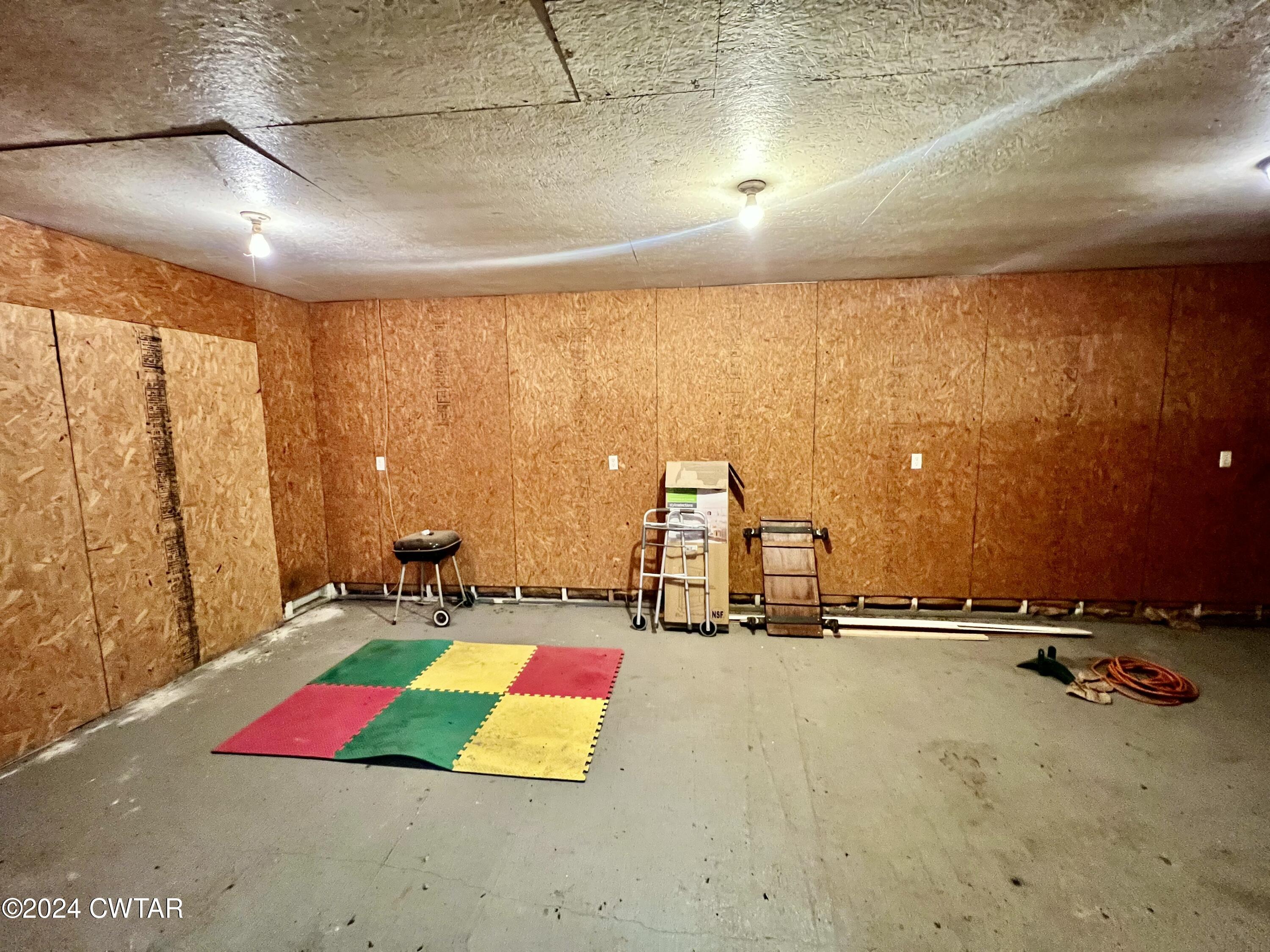 850 Forrester Road Newbern, TN 38059 - Photo 54 of 59 a room with lots of gym equipment and next to a window