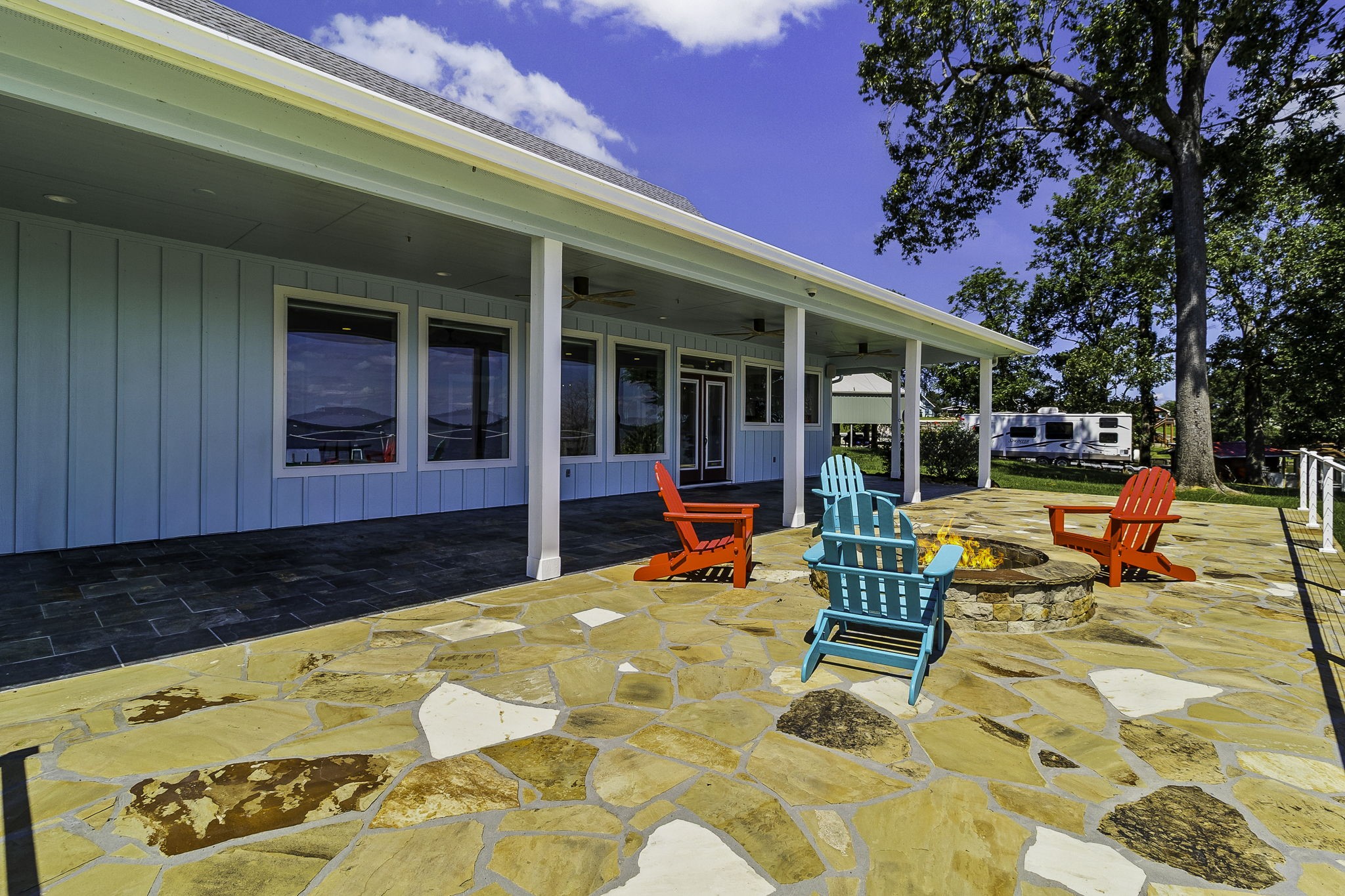 151 Key Largo Loop Point Blank, TX 77364 - Photo 32 of 49 Outdoor oasis, featuring a spacious covered patio, lakeside fire pit, and direct access to the private dock.