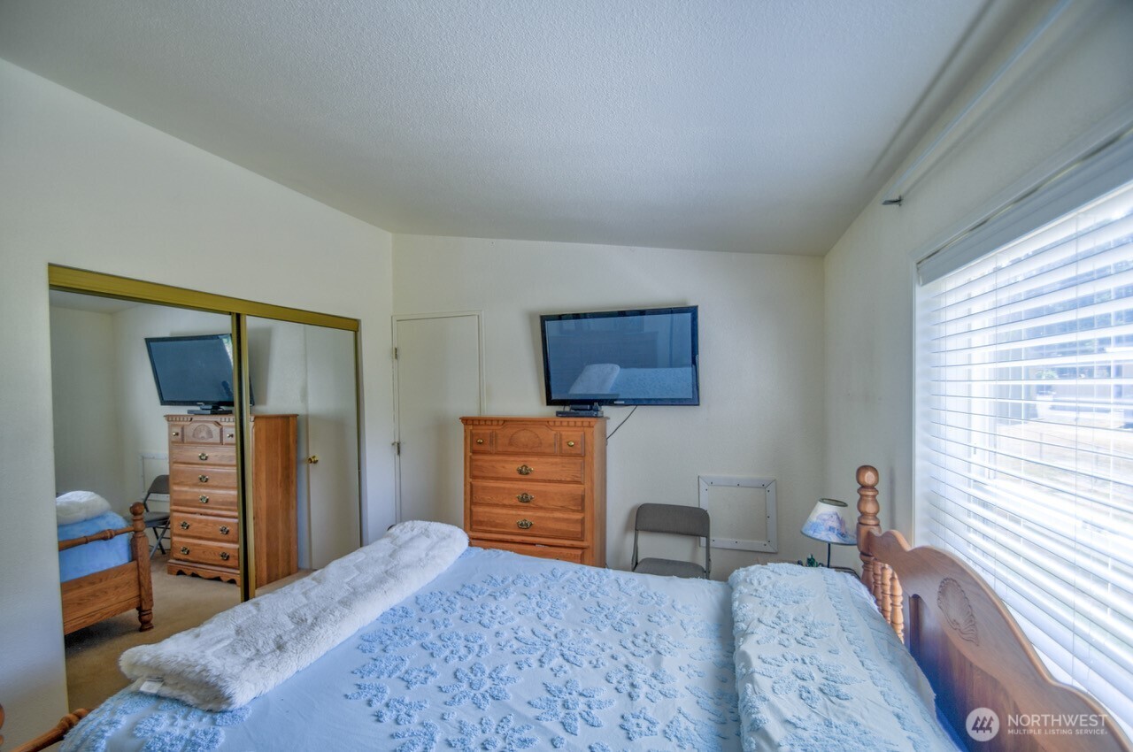 930 Tipsoo Loop North Rainier, WA 98576 - Photo 18 of 40 a bedroom with a bed and furniture