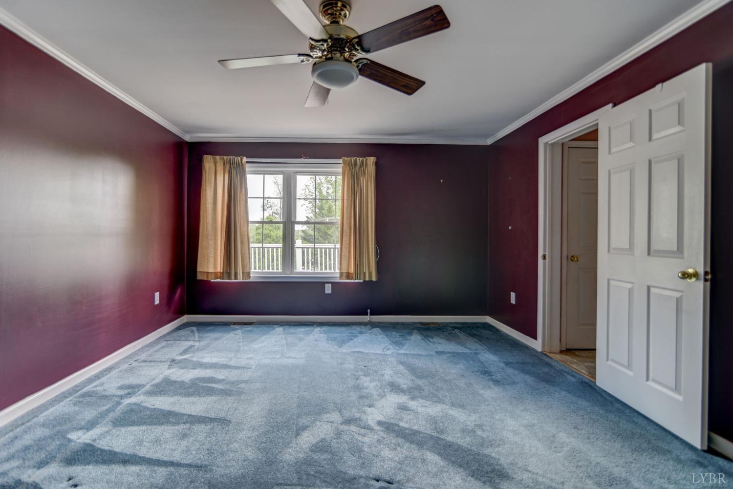 6835 Level Run Road Long Island, VA 24569 - Photo 19 of 57 an empty room with windows and fan