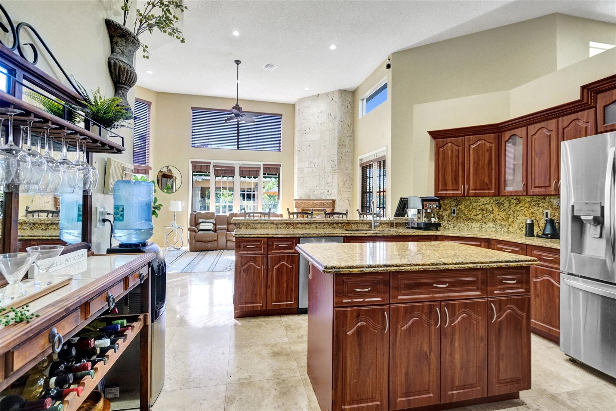3151 Southwest 135th Terrace Davie, FL 33330 - Photo 15 of 74 a kitchen with stainless steel appliances granite countertop a stove a sink dishwasher and a refrigerator
