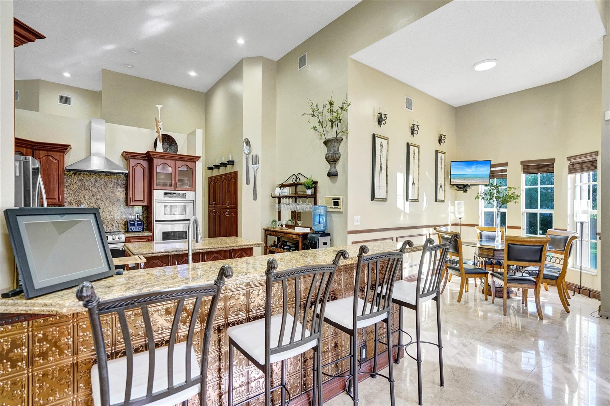 3151 Southwest 135th Terrace Davie, FL 33330 - Photo 16 of 74 a dining room with furniture and wooden floor